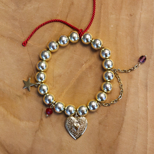 Kralenarmband - goud met bedels en jasseron