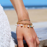 Stainless steel armband met schelpkralen