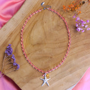 Kralenketting- roze met zilveren zeesterbedel