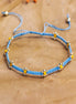 Knotted bracelet with flowers - blue