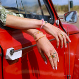 Armband groen met oranje bloem