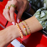 Armband groen met oranje bloem