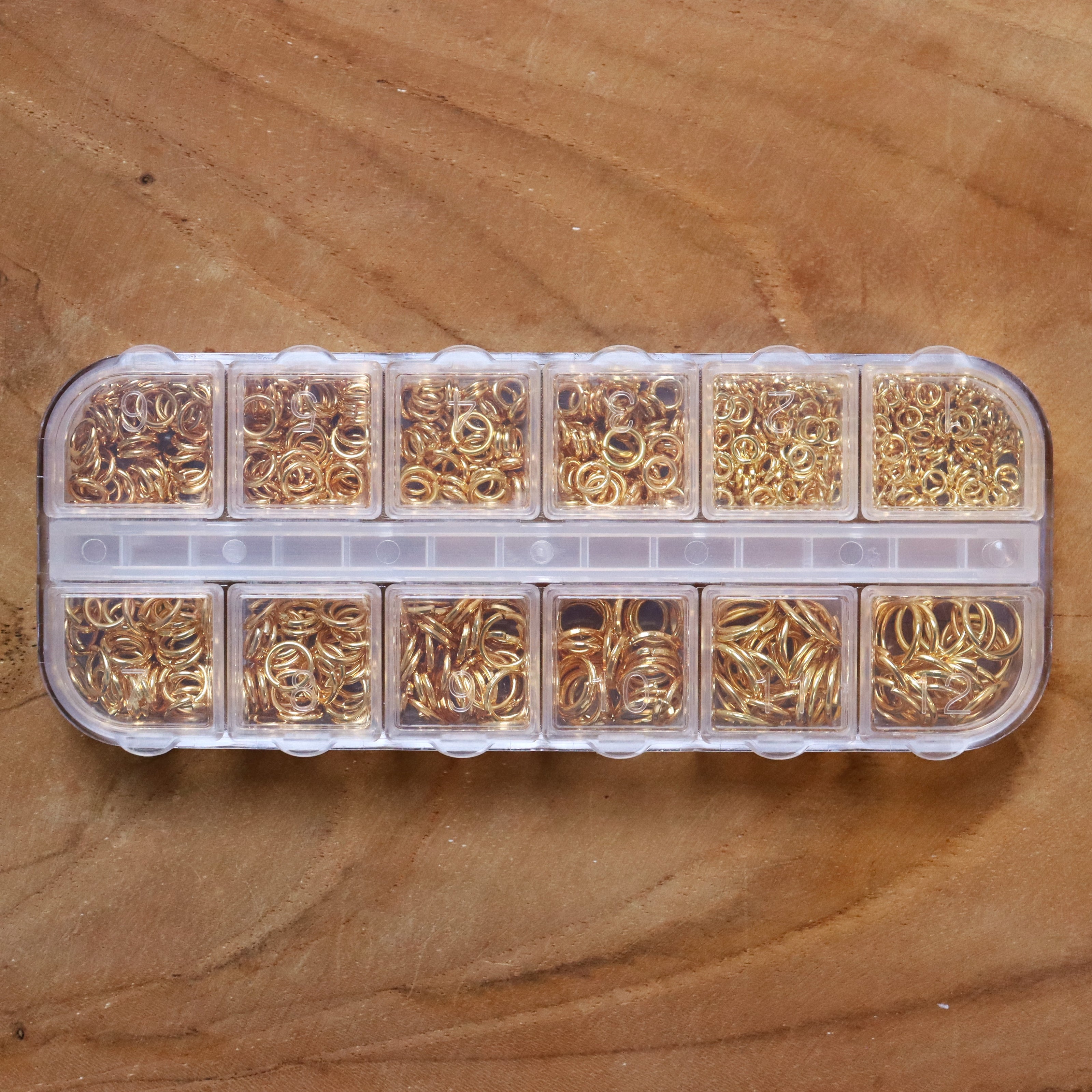 Gevulde kralendoos open ringetjes brass - goud