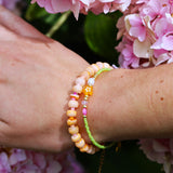 Armband met oranje schelp