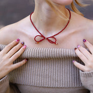 Kralenketting - bordeaux strik zilver