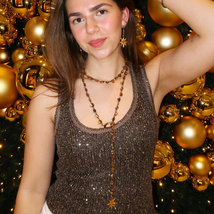 Kralenketting - geknoopt met schelpkralen en sterrenbedel