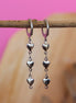 Stainless steel oorbellen met hartjes zilver