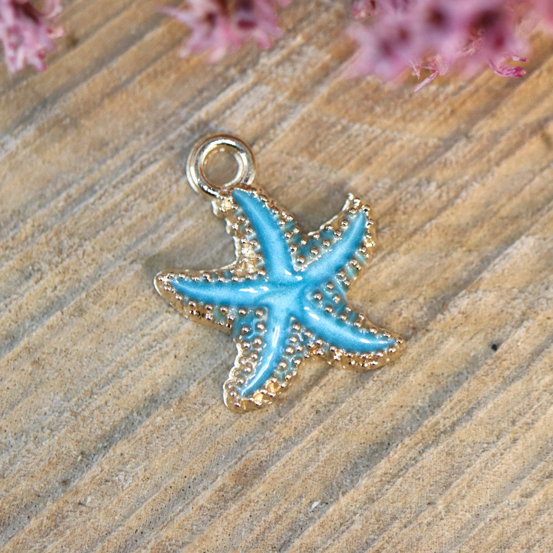 Enamel bedel - blauwe zeester goud