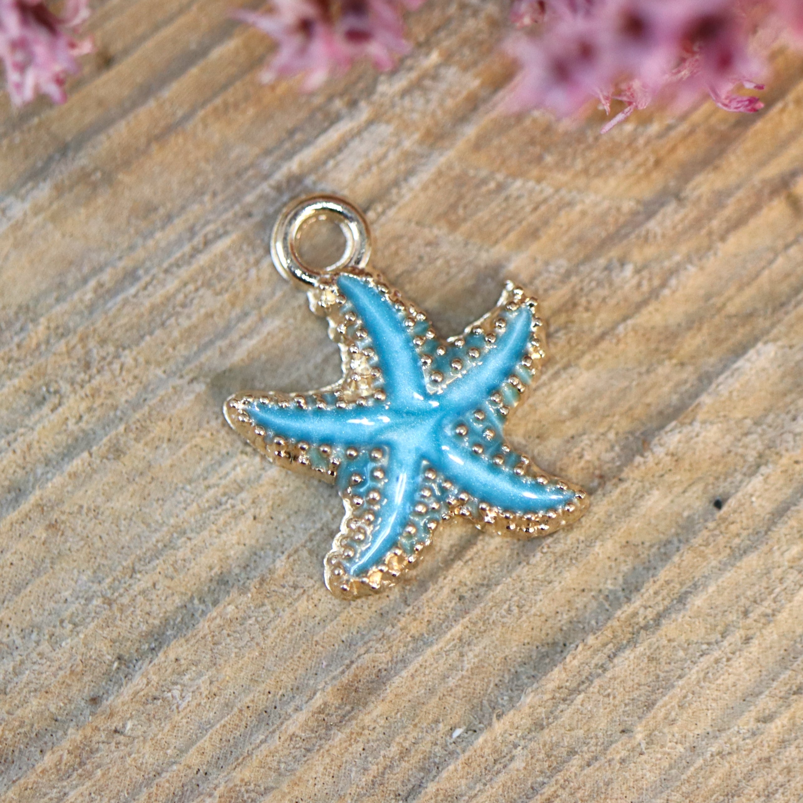 Enamel bedel - blauwe zeester goud