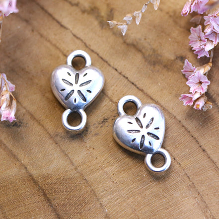 Interposer DQ silver heart with sand dollar