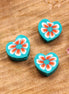 Polymer turquoise heart with red flower