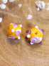 Bead orange - ceramic round with purple dots