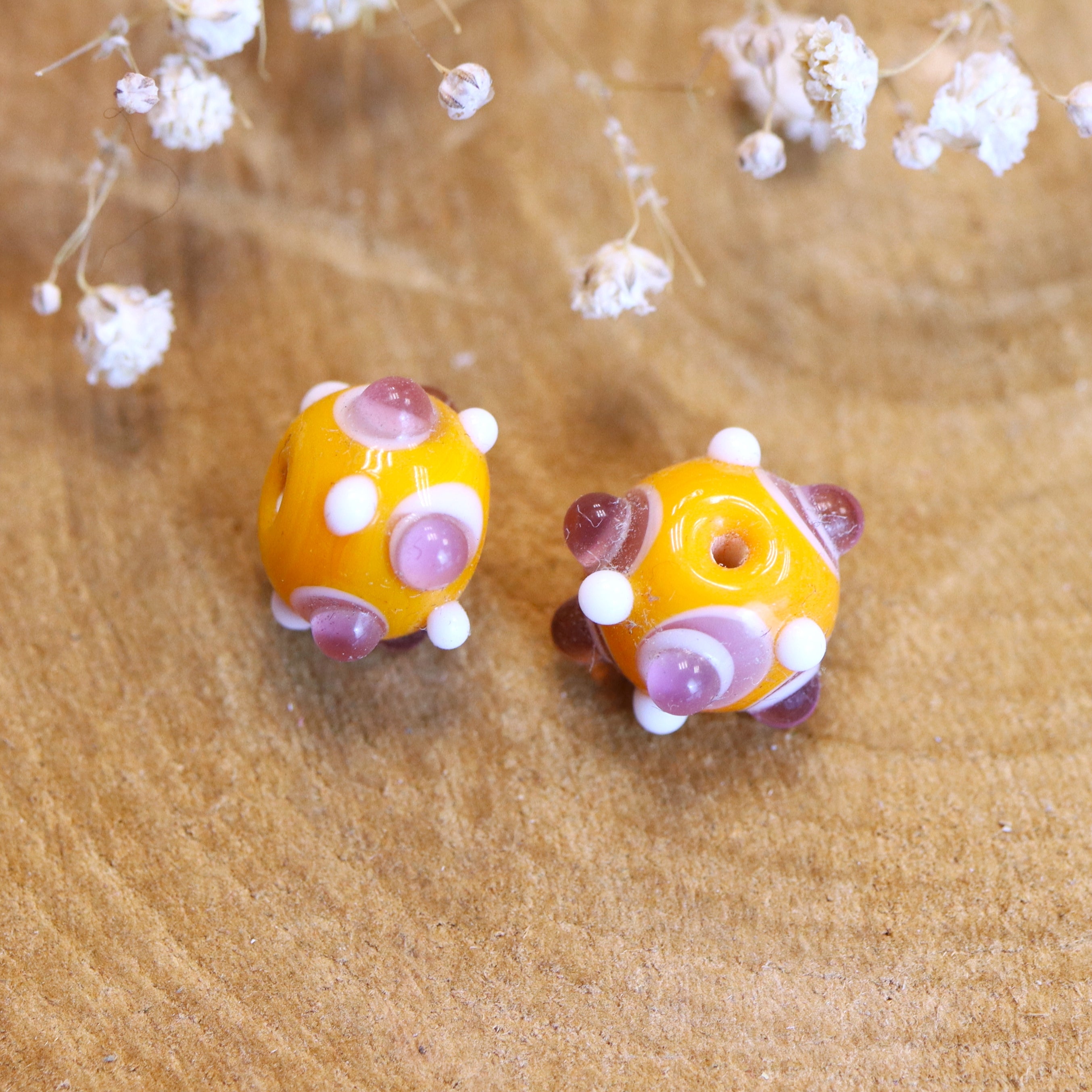 Bead orange - ceramic round with purple dots