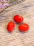Bead red - facet cut oval