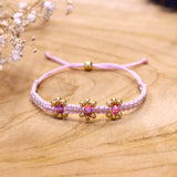 Geknoopte armband met bloemen - lichtroze