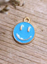 Enamel bedel - smiley blauw goud