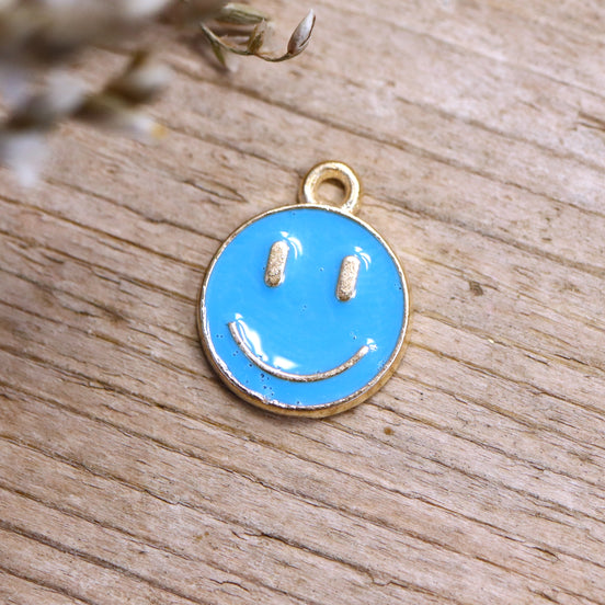 Enamel bedel - smiley blauw goud