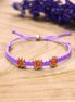 Knotted bracelet with flowers - purple