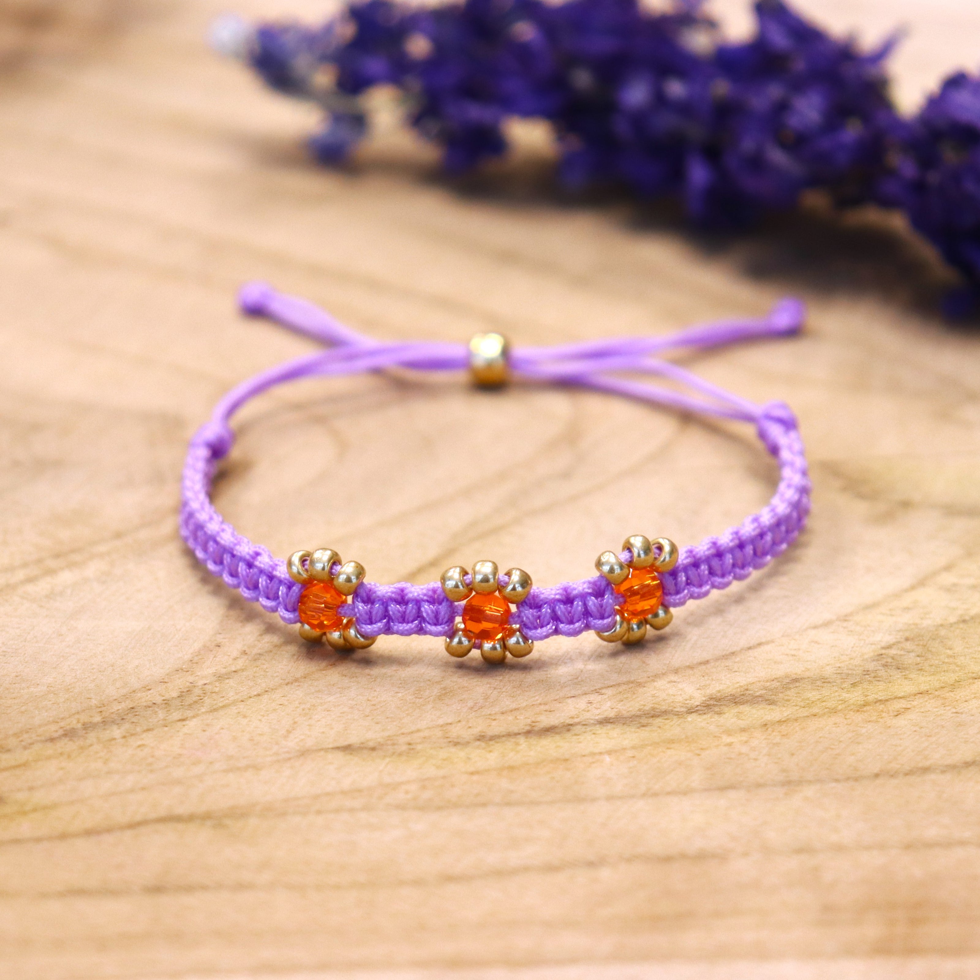 Knotted bracelet with flowers - purple