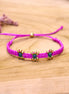 Knotted bracelet with flowers - fuchsia