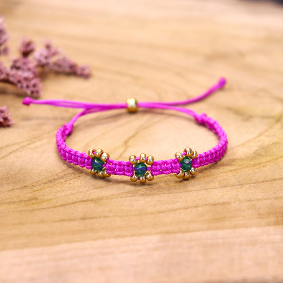 Geknoopte armband met bloemen - fuchsia