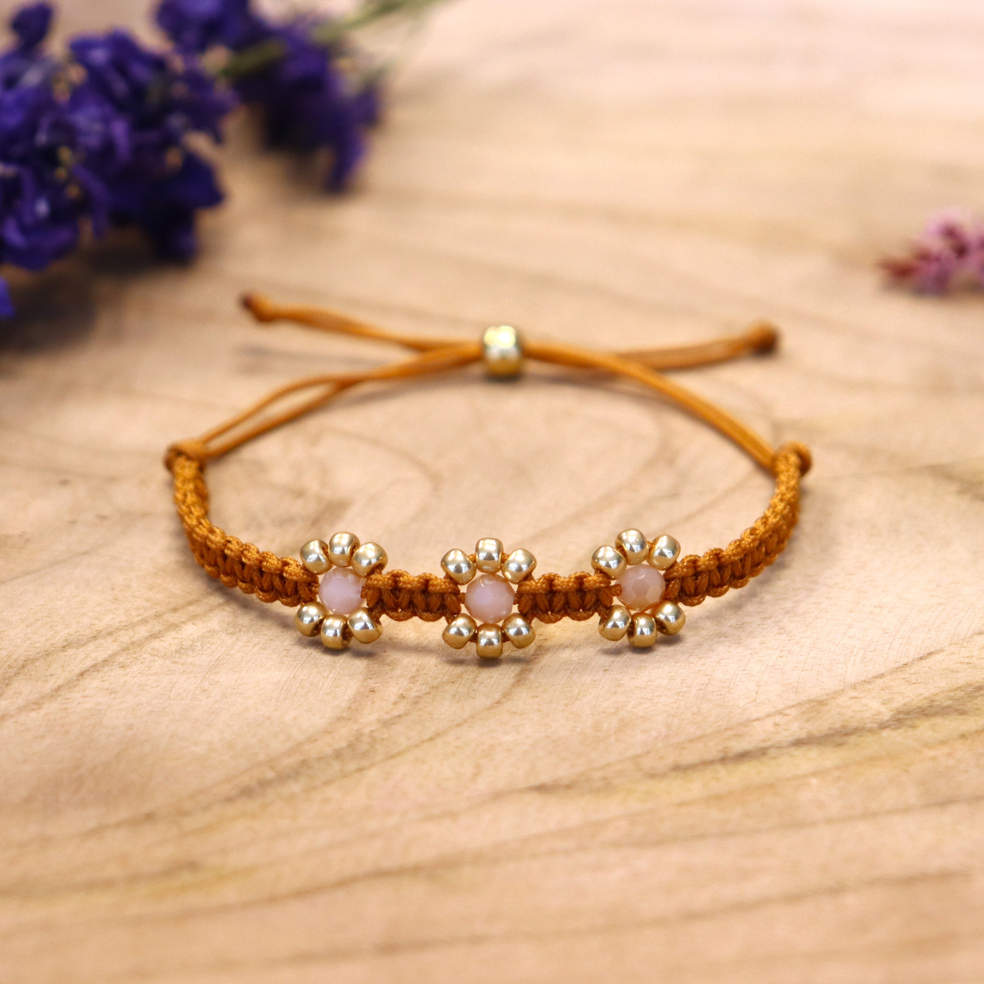 Knotted bracelet with flowers - brown