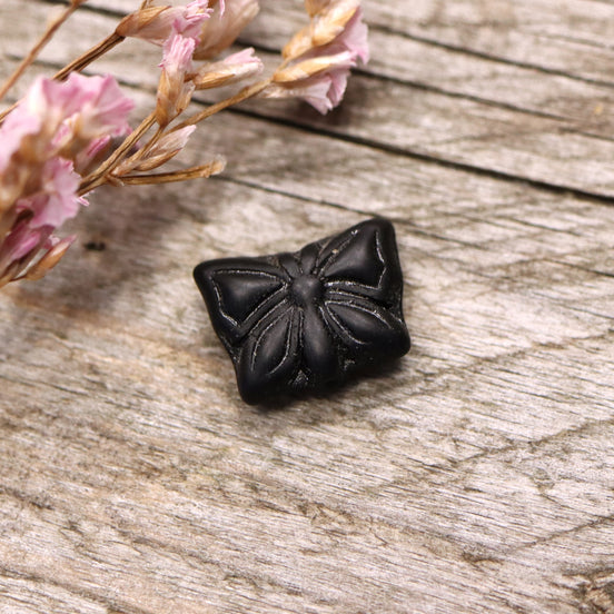 Perle schwarz - Kunststoff Schmetterling