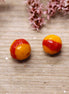 Bead orange - ceramic round with ribbed pattern and red stripe