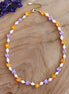 Kralenketting - lila en oranje Miyuki bloemen met zoetwaterparels