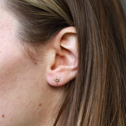 Gold plated stud earrings with open star