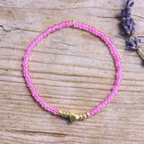 Armband met gouden hartje - neon roze