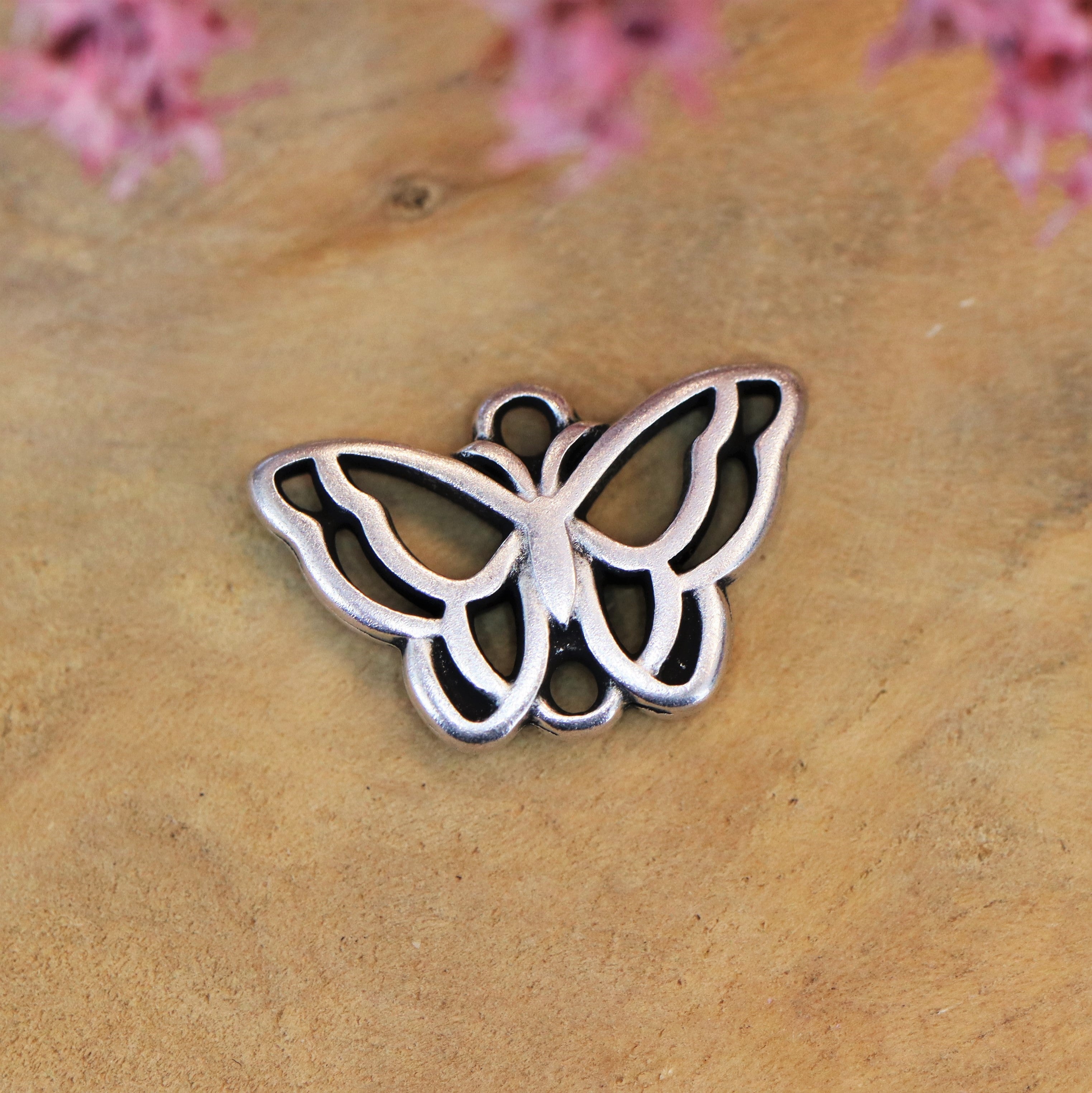 DQ silver butterfly charm