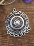 DQ silver charm with 7 eyes at the bottom