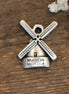 DQ silver windmill charm