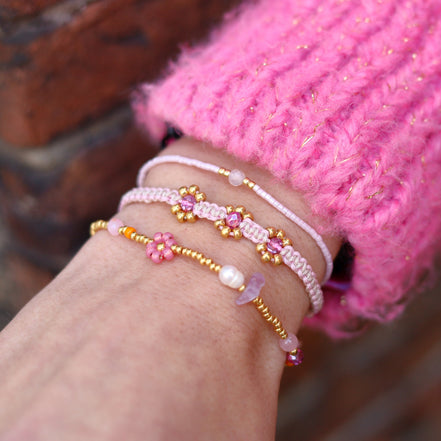 Knotted bracelet with flowers - light pink