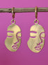 Stainless steel oorbellen met gezicht goud